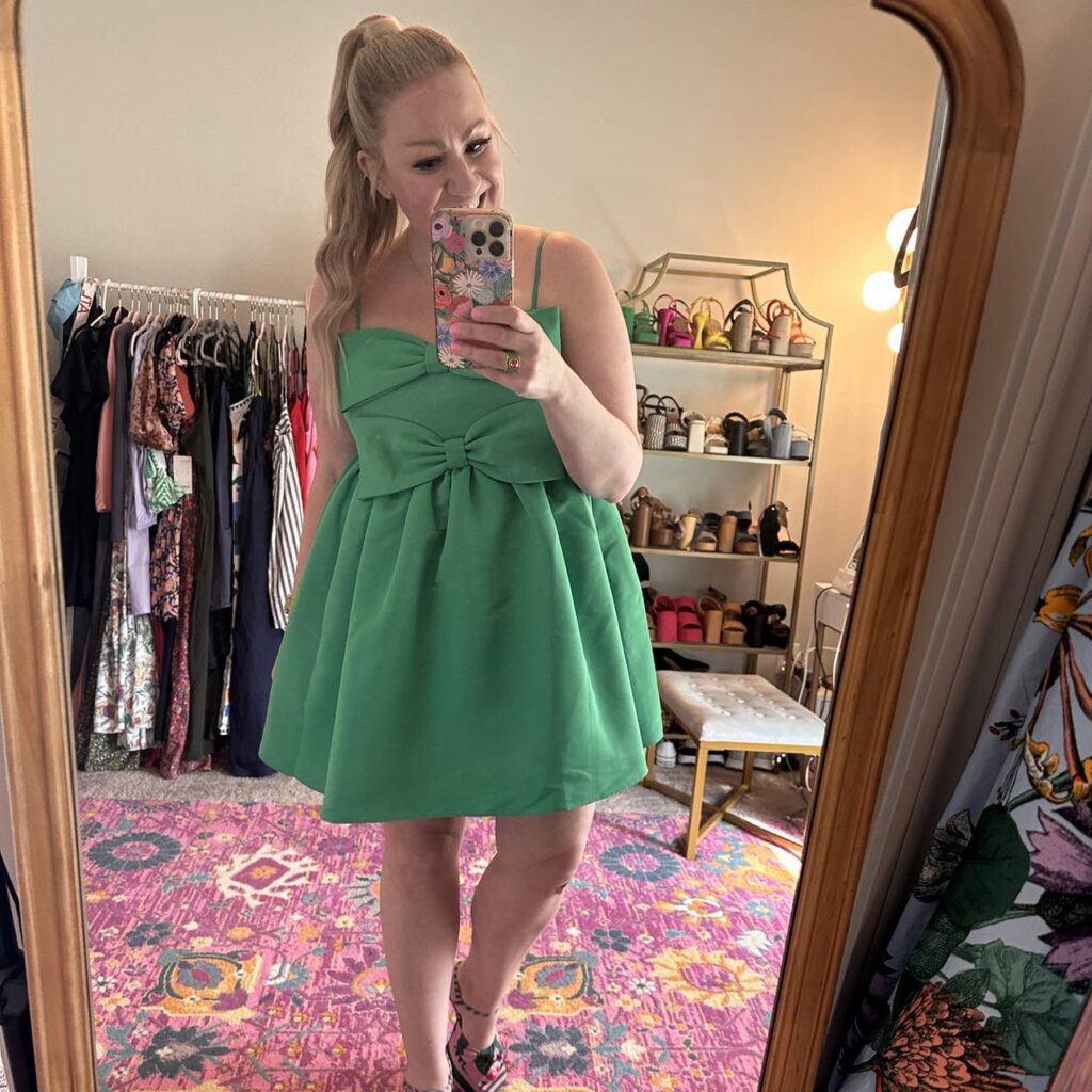 erica from try hard to be pretty in a green bow dress